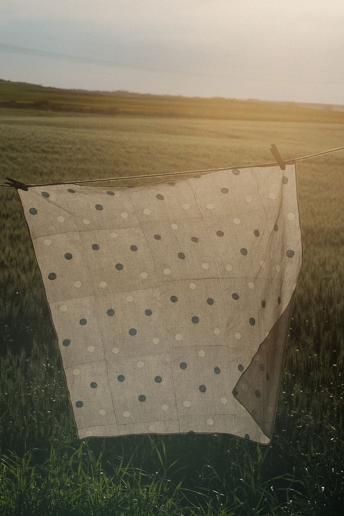 White bandana with scattered blue dot pattern by World of Crow - vintage cotton handkerchief for head wrap and styling.