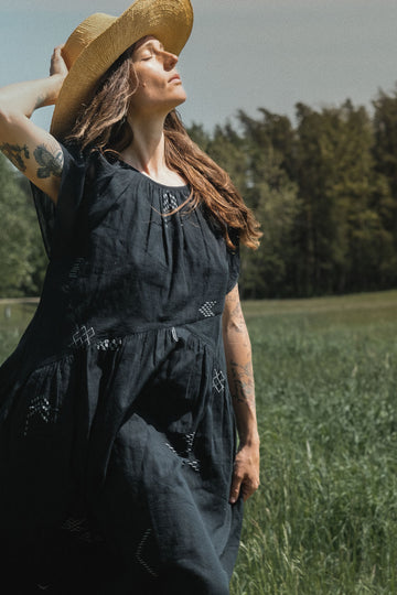 This black dress falls on the body easily. It's made with Jamdani fabric, which is soft and extremely light weight. Perfect for everyday wear. 