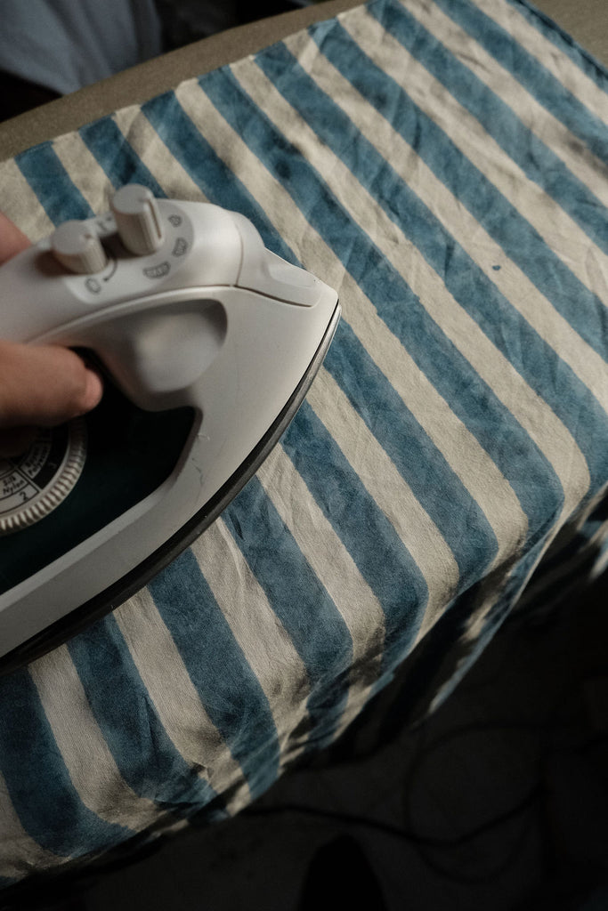 Indigo blue and white vertical striped cotton bandana by World of Crow, handwoven in India using natural dyes and traditional weaving techniques – sustainable unisex accessory for everyday wear.