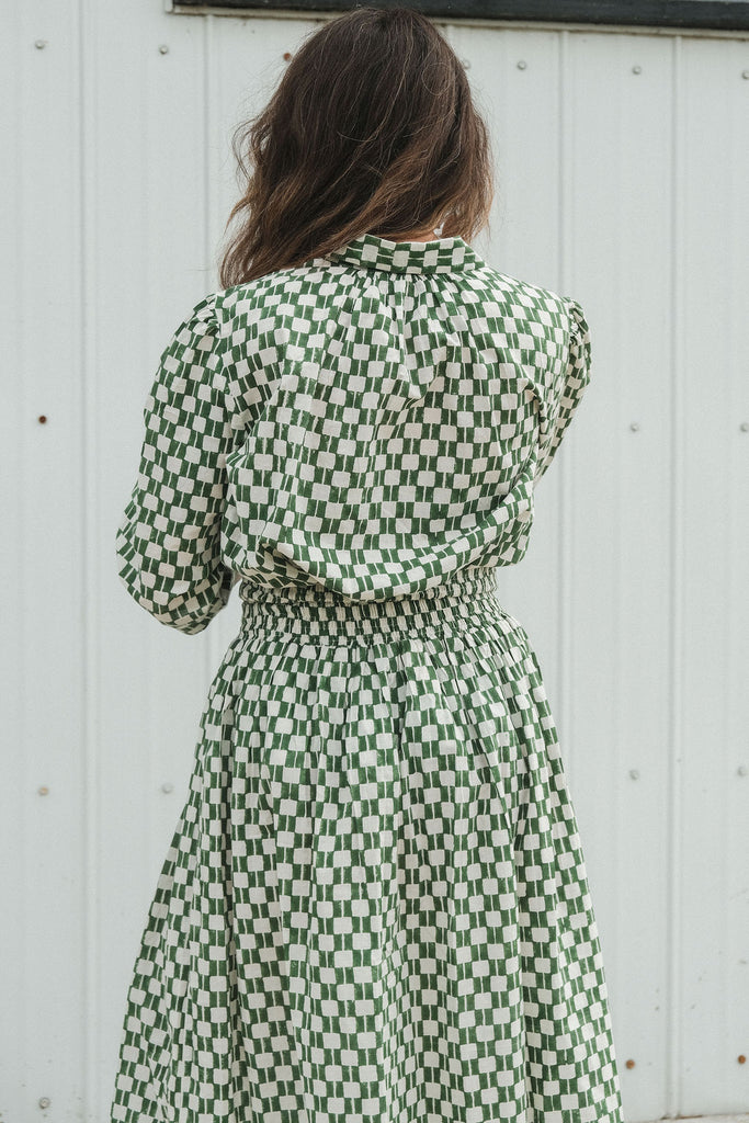 Green and white hand block-printed skirt made from 100% organic cotton, featuring a soft, lightweight fabric with azo-free dyes. Designed with a comfortable elasticated waist, full lining, and side pockets, this ethically made skirt falls 36” from the waist and fits true to size with a relaxed drape over the hips and legs. Each piece is uniquely handcrafted, with natural variations in color and pattern that reflect its artisanal charm—ideal for effortless, everyday wear.