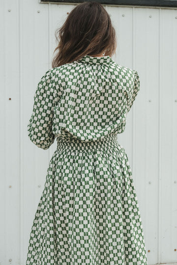 Green and white hand block-printed skirt made from 100% organic cotton, featuring a soft, lightweight fabric with azo-free dyes. Designed with a comfortable elasticated waist, full lining, and side pockets, this ethically made skirt falls 36” from the waist and fits true to size with a relaxed drape over the hips and legs. Each piece is uniquely handcrafted, with natural variations in color and pattern that reflect its artisanal charm—ideal for effortless, everyday wear.