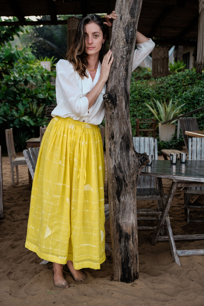 This Lemon Sorbet Skirt is made in collaboration between Erica Kim @ahistoryofarchitecture and World of Crow, it has a yellow color, checks detailing, jamdani fabric, ankle length skirt