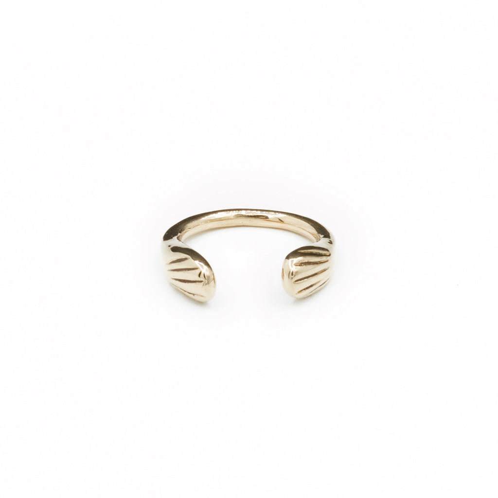 Introducing the sustainably hand-casted silver ring from the Mana Made x CCE Collection, featuring a distinctive wave design inspired by the sea. Crafted from recycled sterling silver and brass, this adjustable ring fits sizes 6 to 9, embodying a commitment to both style and environmental responsibility.