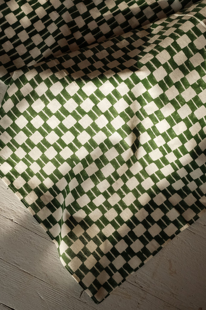 Handwoven green and white checkered cotton bandana by World of Crow, ethically crafted in India using traditional weaving techniques – sustainable and artisanal accessory for conscious fashion lovers