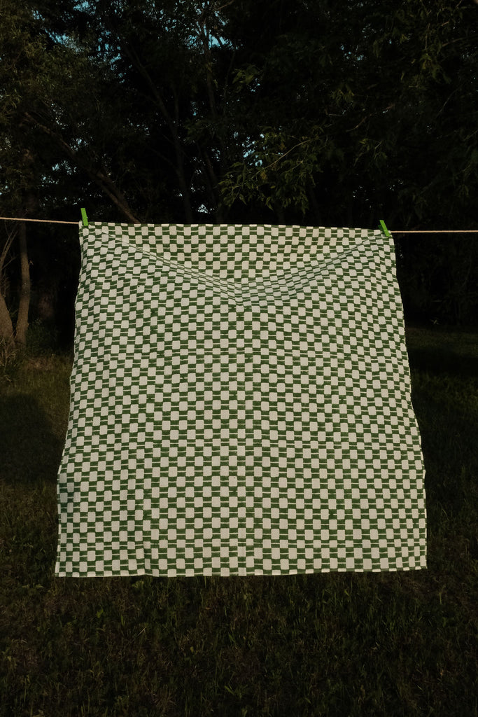 Handwoven green and white checkered cotton bandana by World of Crow, ethically crafted in India using traditional weaving techniques – sustainable and artisanal accessory for conscious fashion lovers