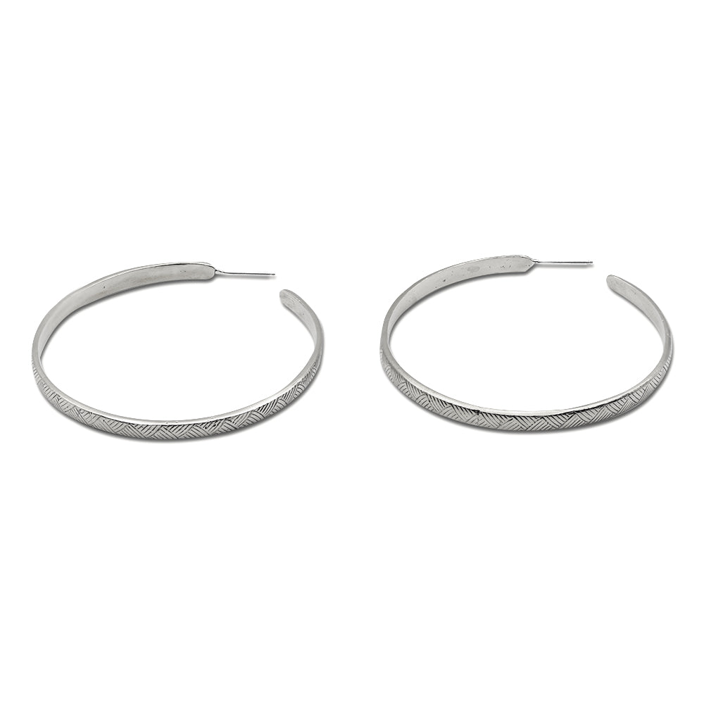 Introducing our vintage-inspired sterling silver hoop earrings, elegantly designed with a graceful curve. Available in small, medium, and large sizes, these hoops offer timeless sophistication and versatility. Handcrafted in solid sterling silver, they are a perfect choice for adding a touch of refined style to any outfit.