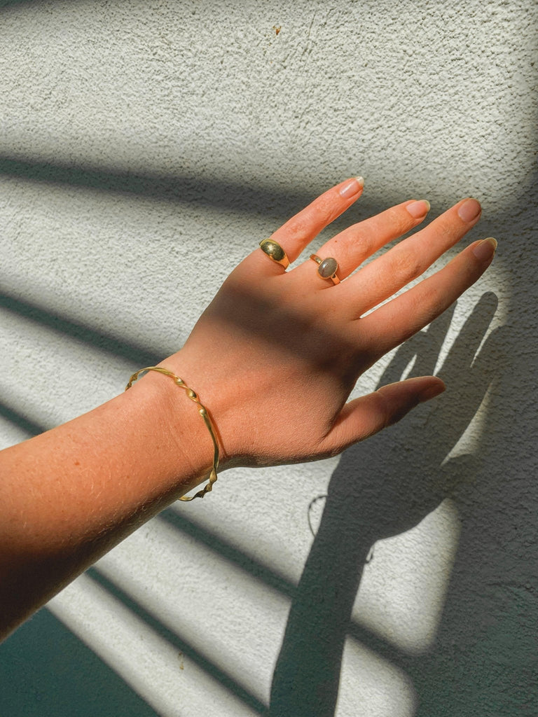 Introducing our elegant Solid 14k Gold Dome Pinky Ring, a refined piece handcrafted in wax with a small oval shape, perfect for your pinky finger. Available in brass or silver and designed in sizes 3-7, this ring embodies a timeless sophistication. Explore the versatility of this uniquely crafted piece that adds a touch of elegance to any style.