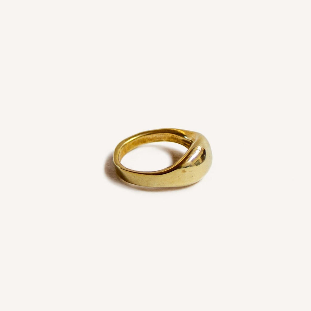 Introducing our elegant Solid 14k Gold Dome Pinky Ring, a refined piece handcrafted in wax with a small oval shape, perfect for your pinky finger. Available in brass or silver and designed in sizes 3-7, this ring embodies a timeless sophistication. Explore the versatility of this uniquely crafted piece that adds a touch of elegance to any style.