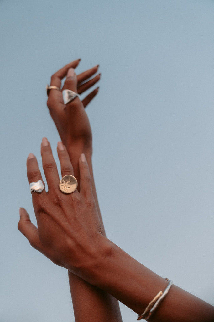 Introducing the Eros Heart Ring, a luxurious signet style crafted from an original wax sculpture and cast in recycled sterling silver. Named after the Greek god of love, this chunky ring is available in brass, gold plated, and 14k gold. Each piece is made to order with meticulous care, perfect for elevating any occasion.