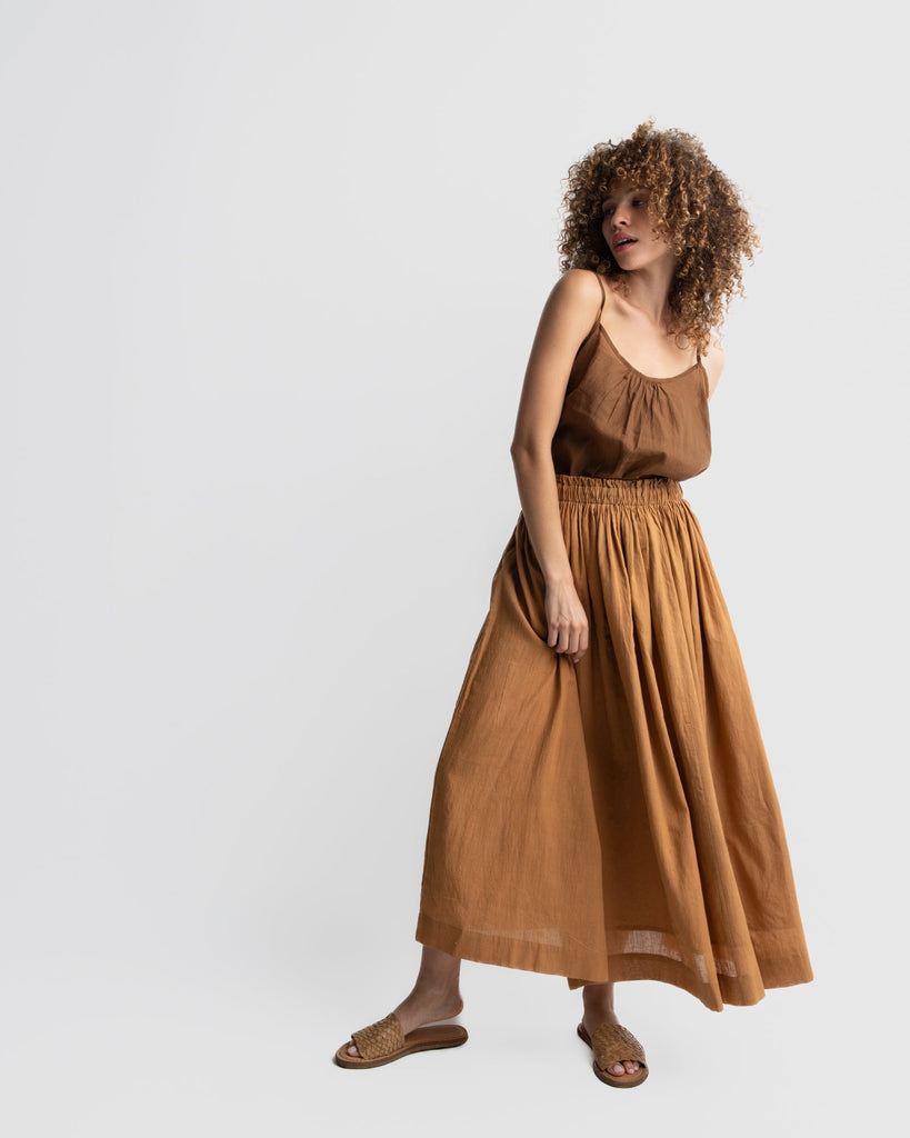 Matte brown gathered skirt, sustainable clothing brands dresses, sustainable dress brands, best organic cotton clothing, clothes made from organic cotton, cotton clothing for women, cotton clothing store, 100 organic cotton women's clothing, 100 percent cotton women's clothing, minimalist wear, how to be a minimalist with clothes