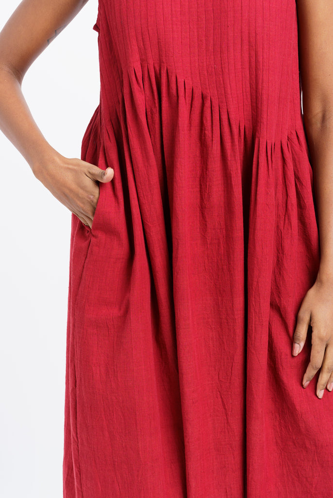 Red pleated midi dress, best ethical clothing brands India, best sustainable clothing brands, organic cotton wear, organic dresses online, cotton only clothing, cotton only clothing store, women's organic dresses, lightweight cotton women's clothing, clothing brands for minimalists, design minimalist wardrobe